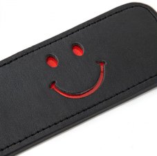 Fly swatter with red smiley